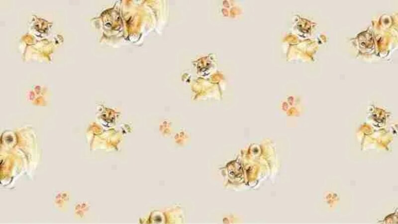 Licht beige tricot stof met leeuwen en pootjes | babystofje kopen bij Stoffenwinkel Online